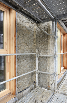 Béton de chanvre Tradical projeté sur les parois bois préfabriquées